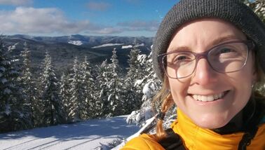 Hannah McSorley selfie in front of a snowy forest