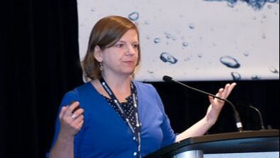 Monica Emelko presenting at a conference